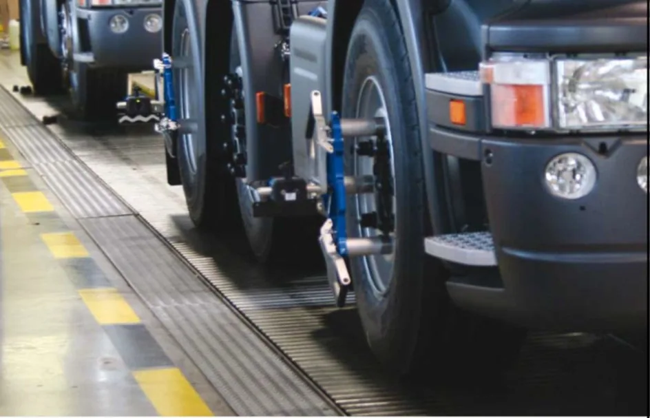 A truck on a wheel alignment bay